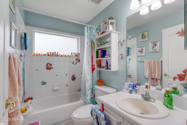 full bathroom featuring shower / tub combo with curtain, toilet, and sink