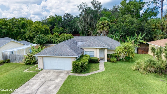 ranch-style home featuring concrete driveway, an attached garage, fence, a front yard, and stucco siding