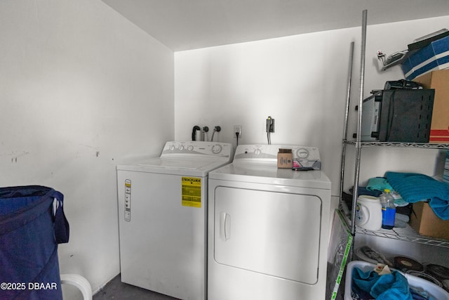 clothes washing area featuring laundry area and washing machine and dryer