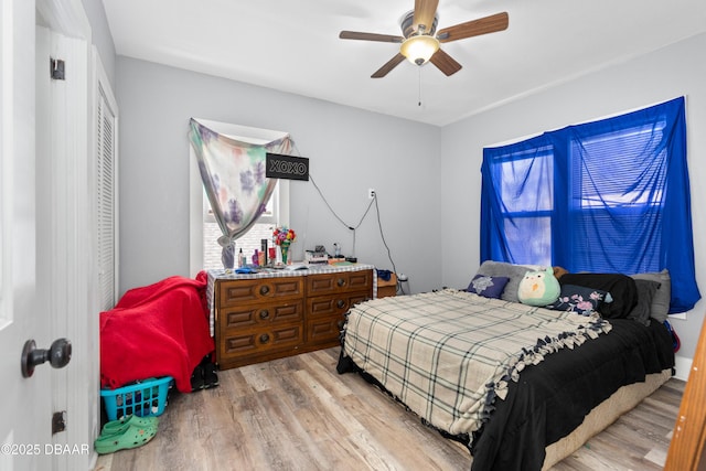 bedroom featuring ceiling fan and wood finished floors