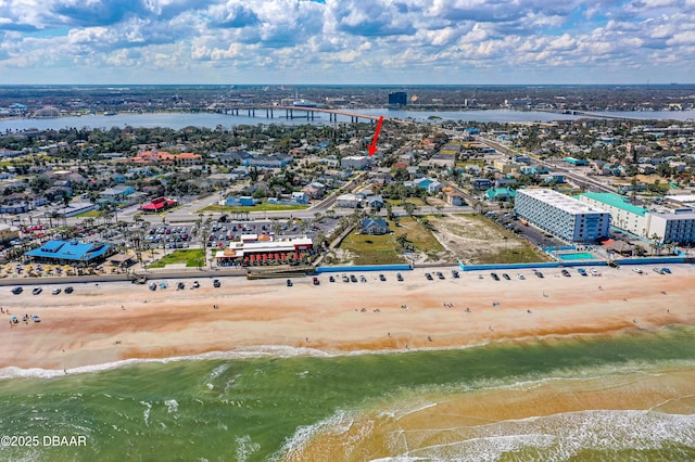 aerial view featuring a water view and a view of the beach