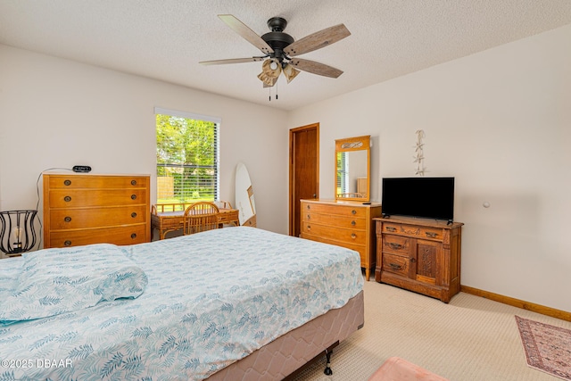 3035 Victory Palm Dr, Edgewater, FL 32141 - bedroom with light carpet, baseboards, ceiling fan, and a textured ceiling