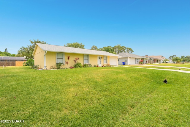 3035 Victory Palm Dr, Edgewater, FL 32141 - single story home featuring a garage, a front yard, and stucco siding