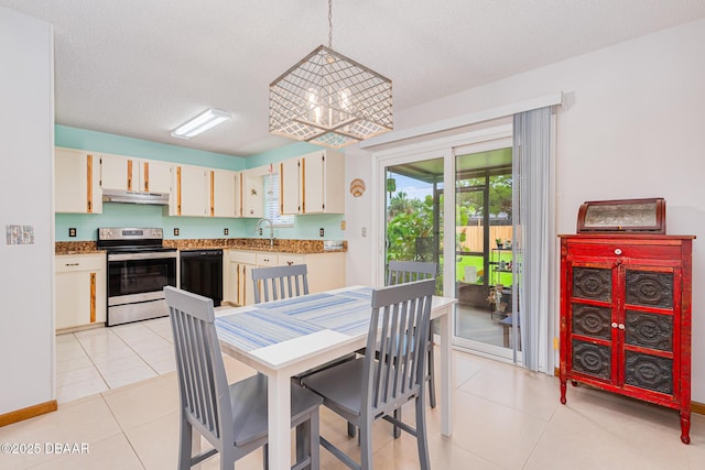 3035 Victory Palm Dr, Edgewater, FL 32141 - dining space featuring light tile patterned floors and a textured ceiling
