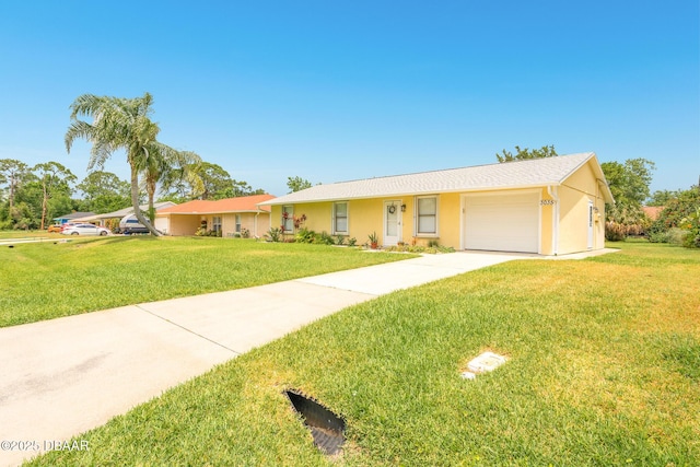 3035 Victory Palm Dr, Edgewater, FL 32141 - single story home featuring a front yard, an attached garage, concrete driveway, and stucco siding
