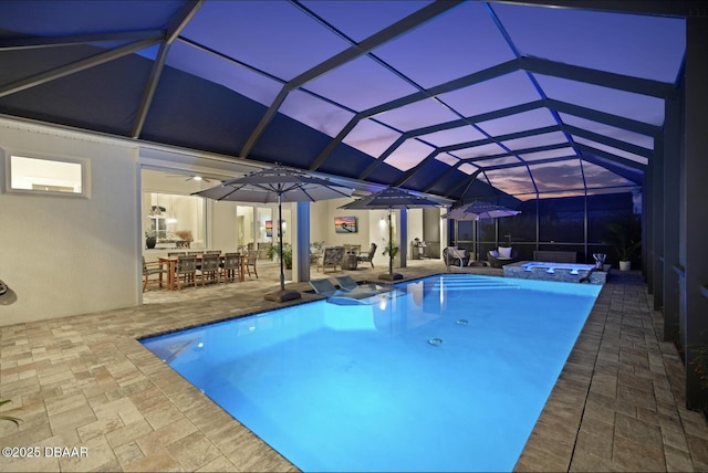 3236 Modena Way, New Smyrna Beach, FL 32168 - view of swimming pool featuring outdoor dining space, a pool with connected hot tub, a patio, a ceiling fan, and a lanai