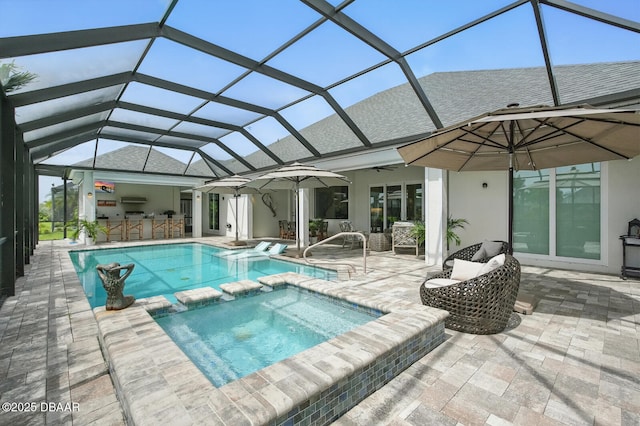 3236 Modena Way, New Smyrna Beach, FL 32168 - view of swimming pool with a patio area, a ceiling fan, glass enclosure, and a pool with connected hot tub