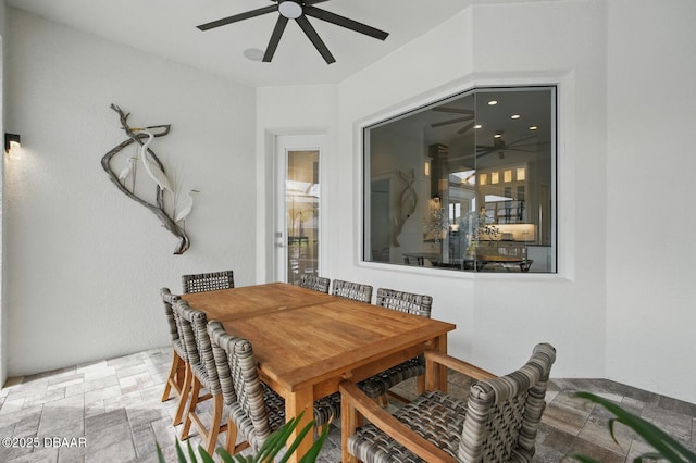 3236 Modena Way, New Smyrna Beach, FL 32168 - dining room featuring ceiling fan and stone finish flooring