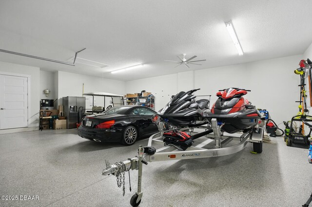 3236 Modena Way, New Smyrna Beach, FL 32168 - garage with stainless steel refrigerator with ice dispenser