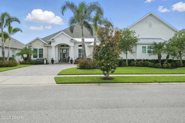 3236 Modena Way, New Smyrna Beach, FL 32168 - view of front of house with driveway and a front yard