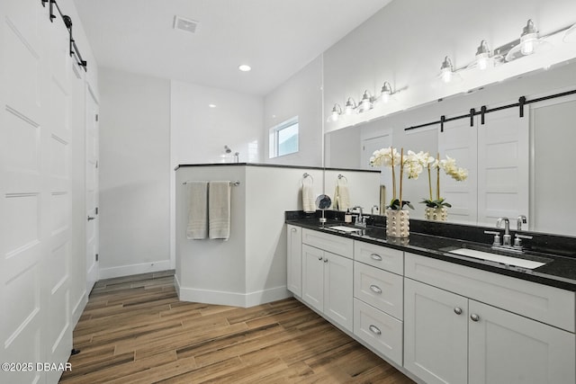 3236 Modena Way, New Smyrna Beach, FL 32168 - full bathroom featuring double vanity, wood finished floors, and recessed lighting