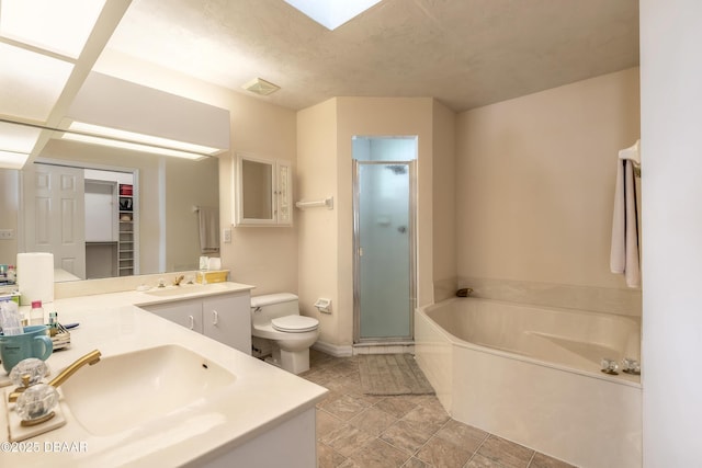 full bath featuring double vanity, a stall shower, toilet, a garden tub, and a sink