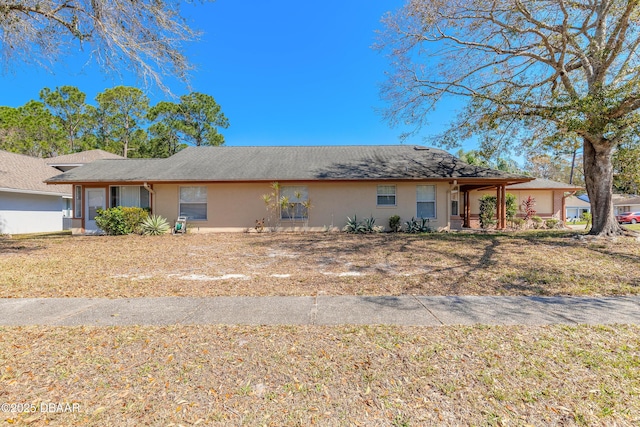 single story home with stucco siding