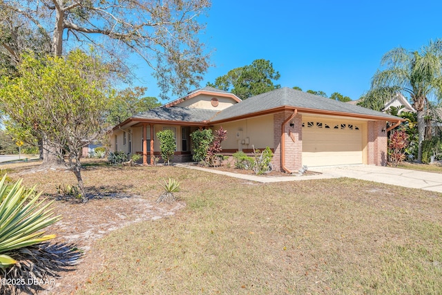 view of front of property with an attached garage, a front yard, concrete driveway, and brick siding