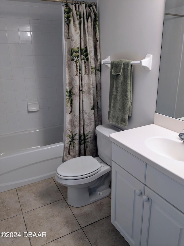 3311 S Atlantic Ave Unit 604, Daytona Beach, FL 32118 - bathroom featuring vanity, tile patterned floors, and shower / bath combo with shower curtain