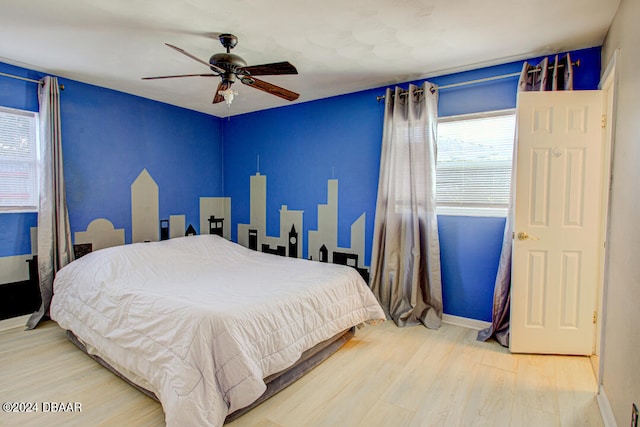 bedroom featuring ceiling fan and hardwood / wood-style floors