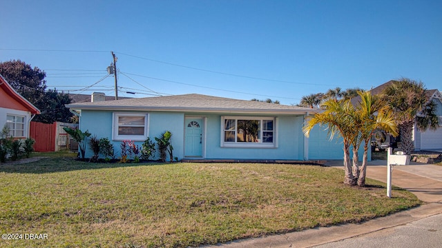 ranch-style house featuring a front yard