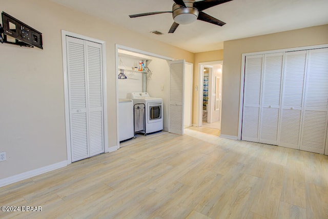 laundry room with ceiling fan, light hardwood / wood-style flooring, and washer and dryer