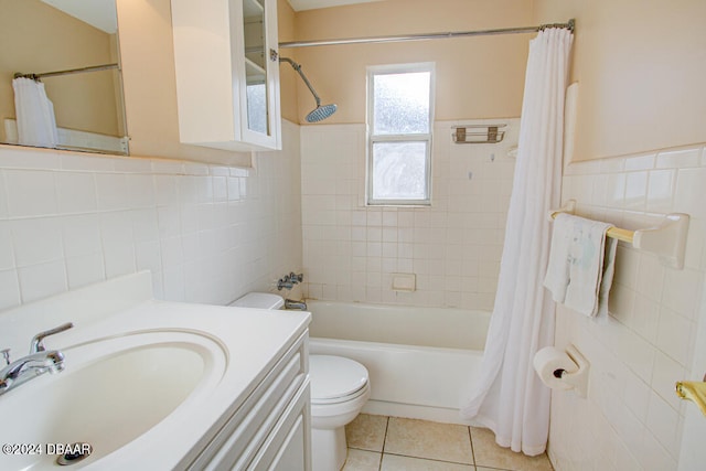 full bathroom with shower / bath combo, vanity, tile walls, tile patterned flooring, and toilet