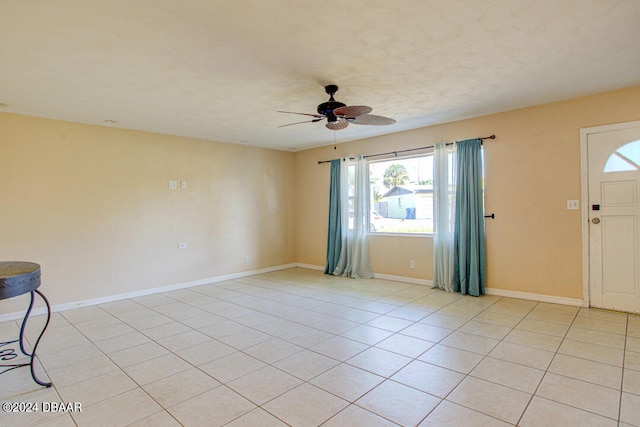 interior space with ceiling fan