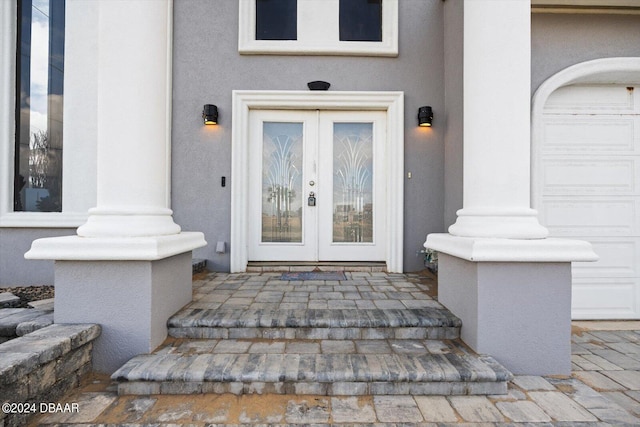 view of exterior entry featuring french doors