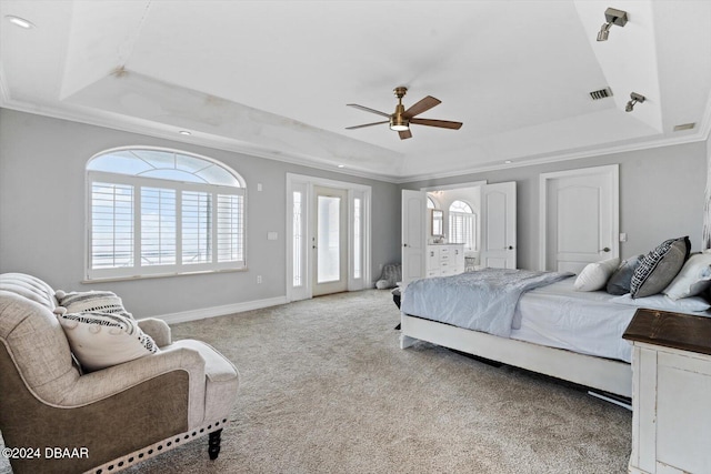 bedroom with crown molding, light colored carpet, a raised ceiling, and multiple windows