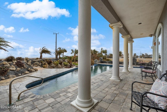 view of pool featuring a patio