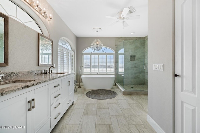 bathroom featuring independent shower and bath, vanity, and ceiling fan