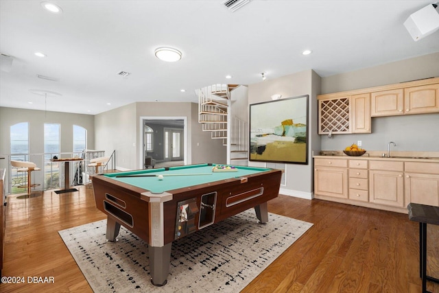 rec room featuring billiards, dark hardwood / wood-style flooring, and wet bar