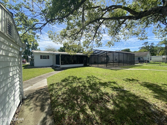 55705 Keith St, Astor, FL 32102 - view of yard with a lanai