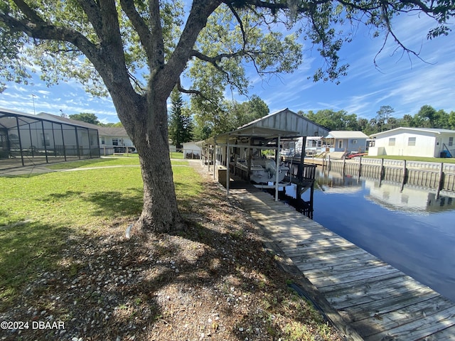 55705 Keith St, Astor, FL 32102 - view of dock featuring a water view, a residential view, and a lawn
