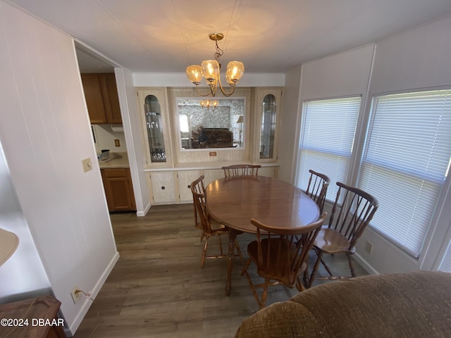 55705 Keith St, Astor, FL 32102 - dining area with plenty of natural light, a chandelier, and wood finished floors