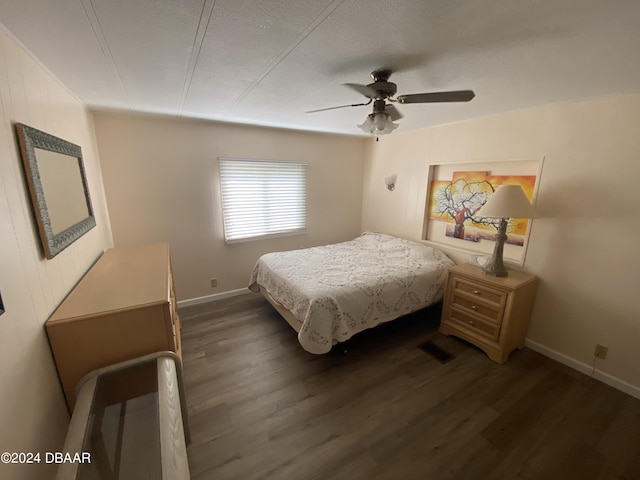 55705 Keith St, Astor, FL 32102 - bedroom with a textured ceiling, baseboards, a ceiling fan, and wood finished floors