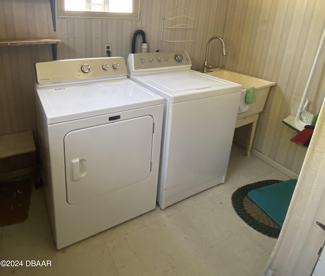 55705 Keith St, Astor, FL 32102 - laundry room with wood walls, light floors, separate washer and dryer, and laundry area