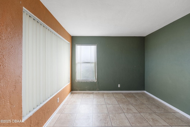 spare room with light tile patterned flooring