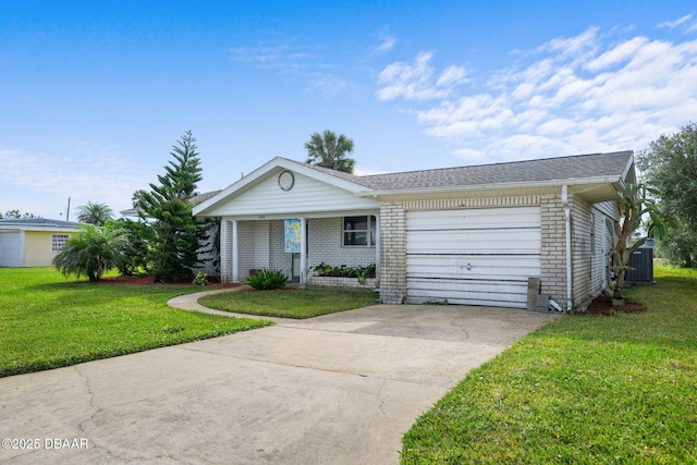 ranch-style house featuring cooling unit, a garage, and a front yard