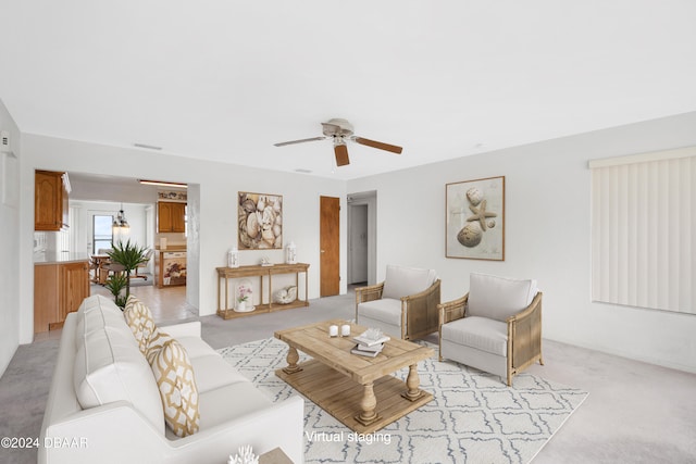 living room with light carpet and ceiling fan