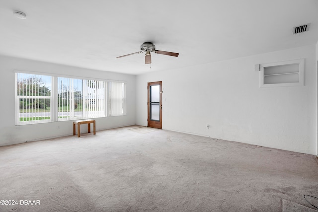 carpeted empty room with ceiling fan