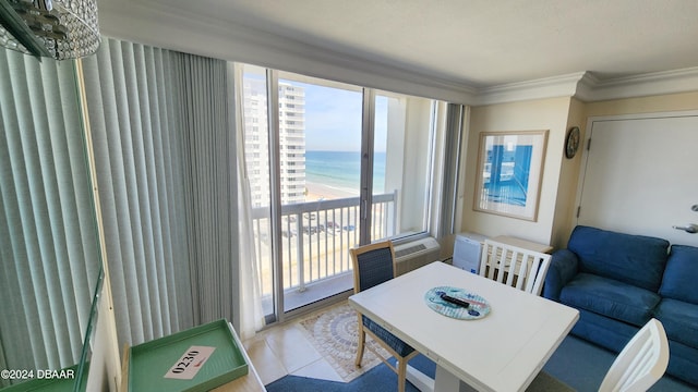 2700 N Atlantic Ave Unit 918, Daytona Beach, FL 32118 - dining area featuring healthy amount of natural light, a water view, crown molding, and tile patterned flooring
