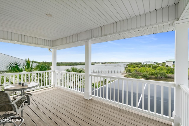 wooden deck with a water view