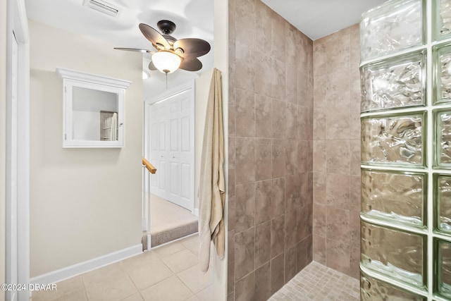 bathroom with ceiling fan, tile patterned floors, and tiled shower