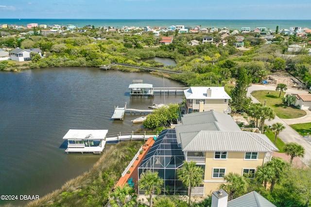 birds eye view of property featuring a water view