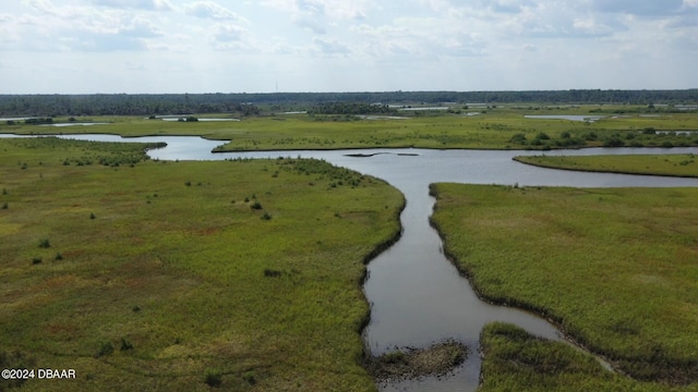 drone / aerial view featuring a water view and a rural view