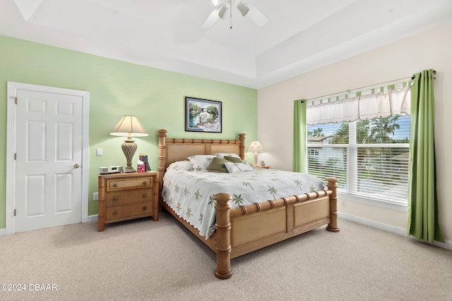 bedroom featuring light carpet and ceiling fan