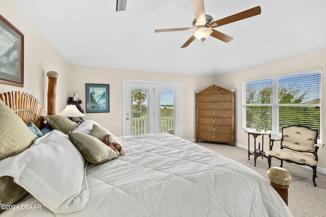 bedroom with ceiling fan, light colored carpet, and access to outside