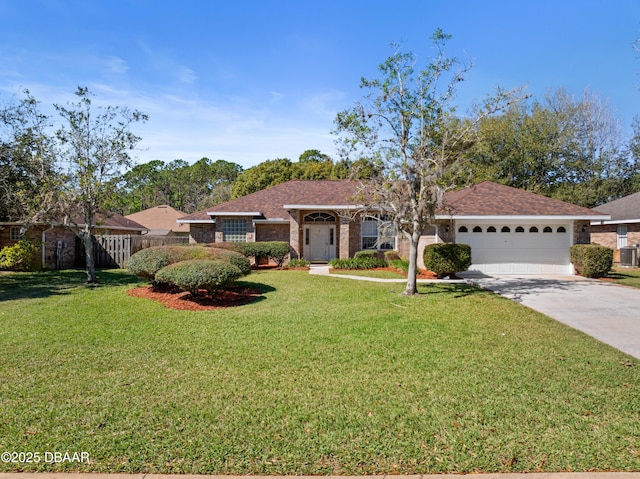 ranch-style home featuring brick siding, an attached garage, a front yard, fence, and driveway