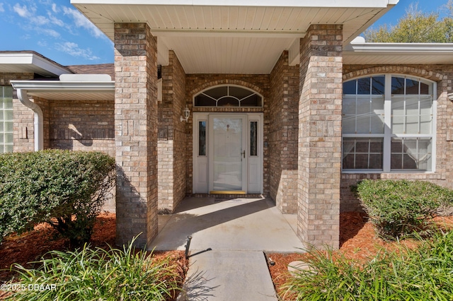 entrance to property with brick siding