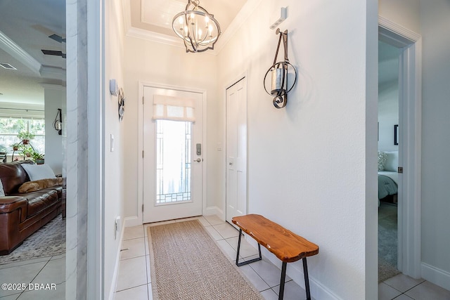 1321 Tullamore Blvd, Ormond Beach, FL 32174 - living room featuring a tray ceiling, a ceiling fan, ornamental molding, light tile patterned flooring, and baseboards