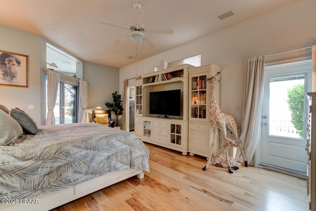 3102 N Springwater Ct N, Port Orange, FL 32128 - bedroom featuring access to exterior, light wood finished floors, and ceiling fan