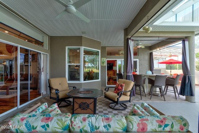 3102 N Springwater Ct N, Port Orange, FL 32128 - view of patio featuring a ceiling fan, exterior bar, and an outdoor living space with a fire pit